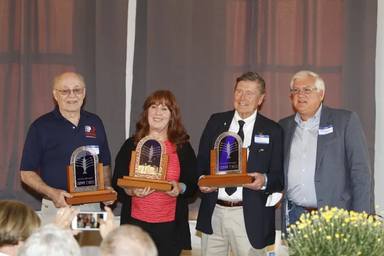 2018 Honorees: Jim Dreher, Susan Palazolo, and Joe Callanan accept their Achievement Awards with Friends of Detroit Rowing Marketing Chair, Todd Platt