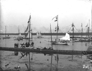 Sailboats compete in regatta on the Detroit River. Recorded in glass negative ledger: "LD/River-Regattas."